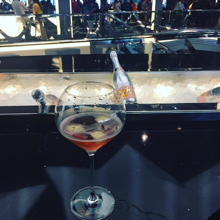 Half-full glass of wine at the bar on-board MSC Meraviglia