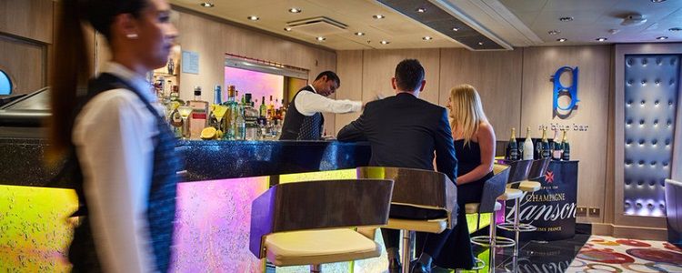 Staff and guests in the Blue Bar on-board a P&O Cruises ship