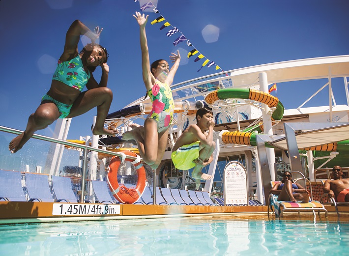 Children leaping into the swimming pool on-board Royal Caribbean's Harmony of the Seas