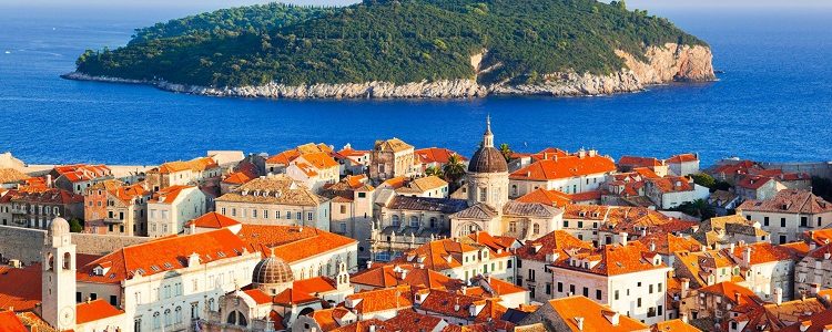 View out to a Croatian island from the orange rooftops of Dubrovnik