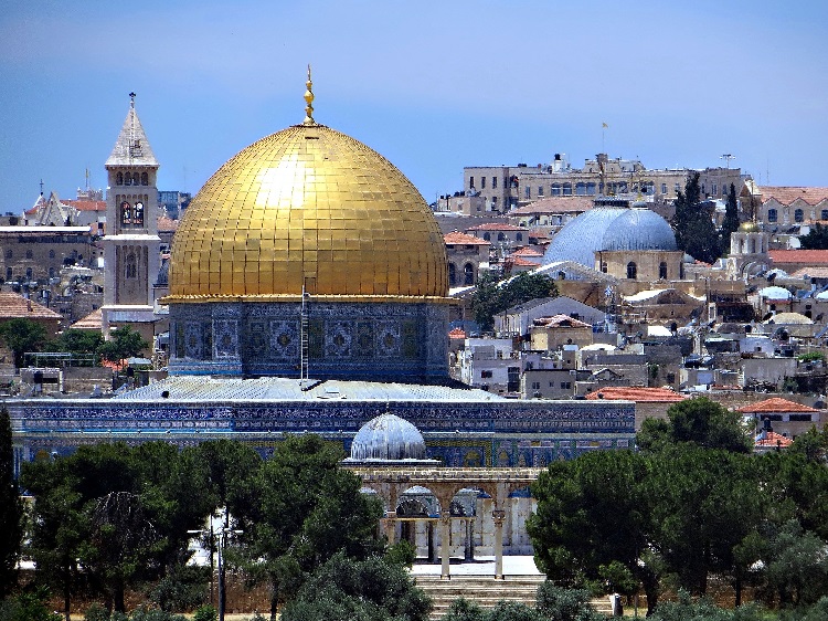 The gold dome of the Dome of the Rock glinting in the sunshine in Jerusalem