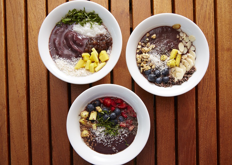 A selection of healthy acai bowls on a table on a Celebrity Cruises ship