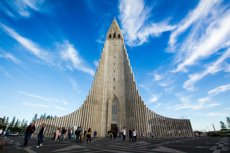 People walking into Hallgrimskirkja Church in Reykjavik cruise port in Iceland