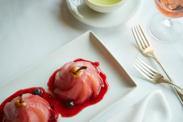 A poached pear dessert in a restaurant on-board Holland America Line's ms Oosterdam