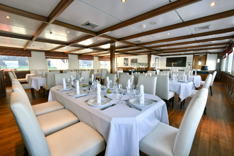 The main dining room on-board the Celebrity Xperience expedition cruise ship
