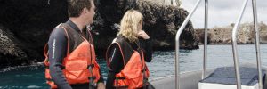 A couple on a Galapagos expedition with Celebrity Xperience on a Zodiac excursion