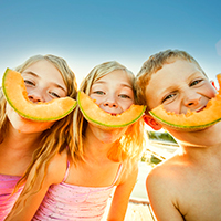 Children Eating Melon