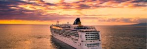 Large cruise ship sailing at sunset