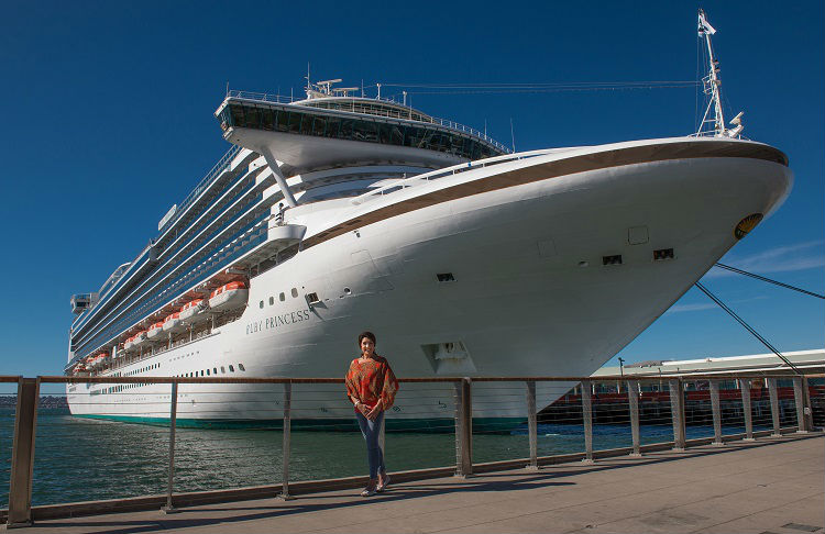Jane McDonald standing in front of Ruby Princess