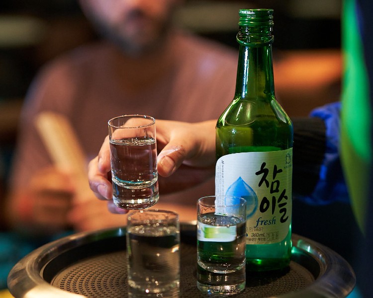 Shots of soju shared out during games in Gunbae